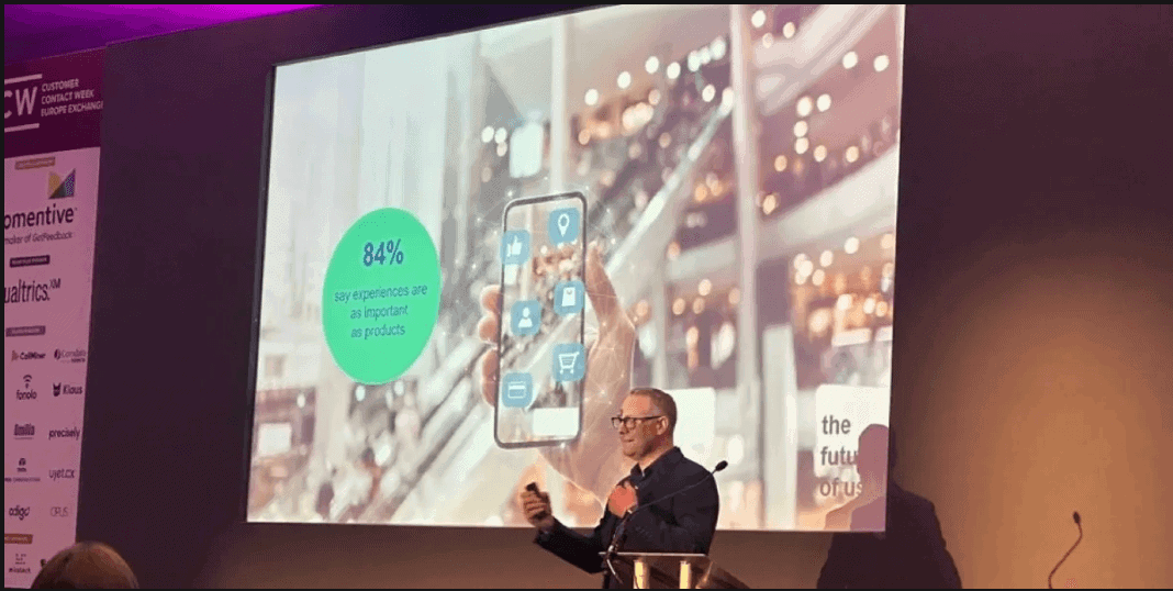Business presenter with digital overlay of connectivity icons on screen.