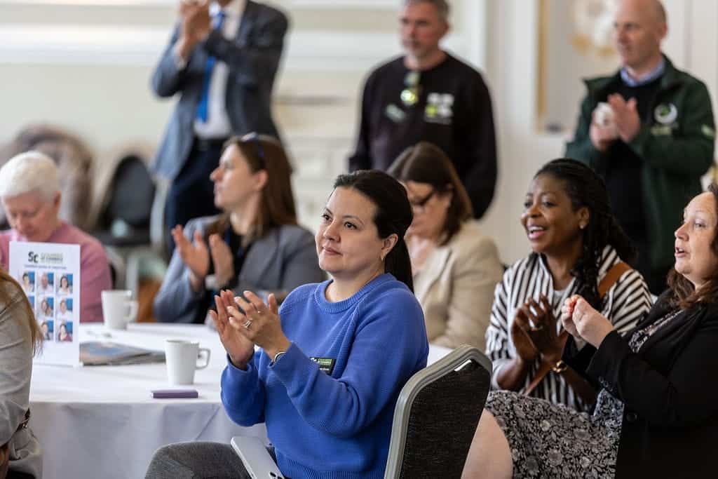 People clapping at the Chamber event in The Spa Hotel.